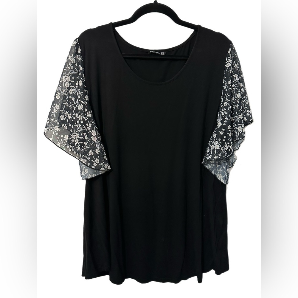 BloomChic stretchy black pullover top with sheer floral flutter sleeves. Size 22